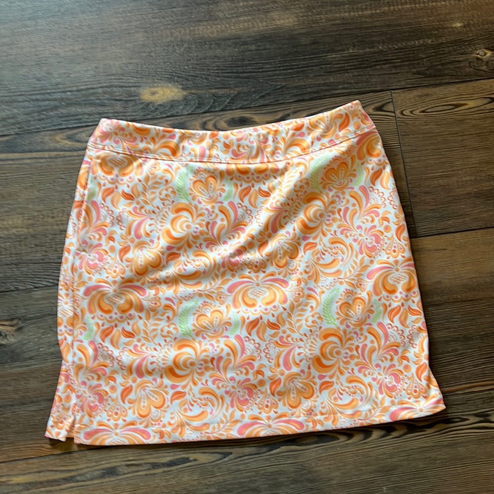 Greg Norman Golf Skort. Orange/ pink